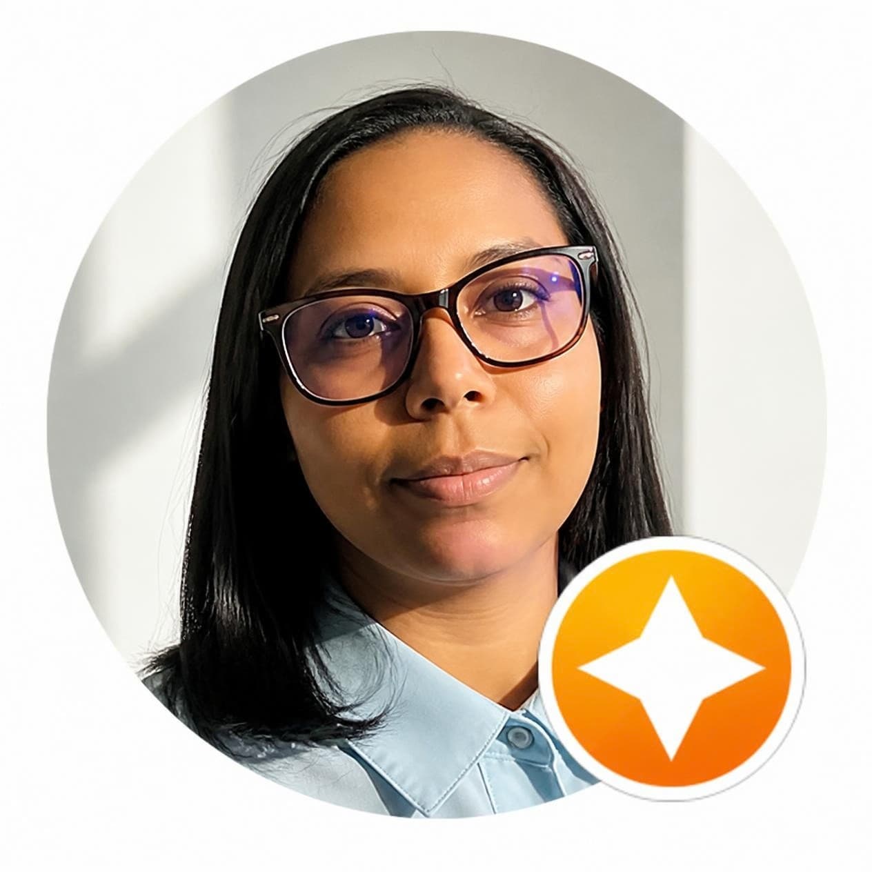 Circular headshot of a woman with dark hair and glasses, featuring an orange star icon.